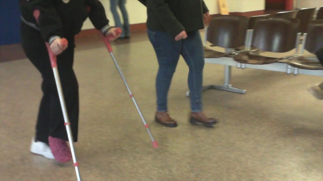 130- Girl pink sock-crutches-wheelchair