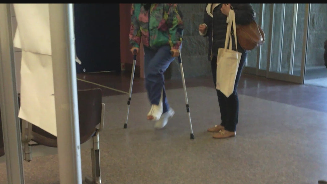 183 - Lady white Slc - crutches - wheelchair